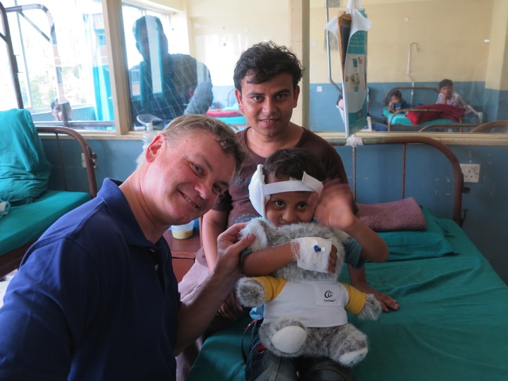 Dr. David Foyt with Nepalese boy who received donated cochlear implant.